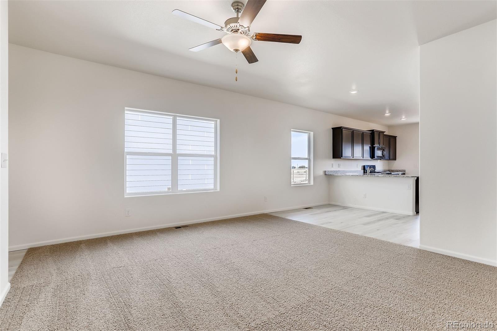 47517 Clover Avenue Bennett, CO 80102 - Photo 4 of 22 a view of an empty room with a window