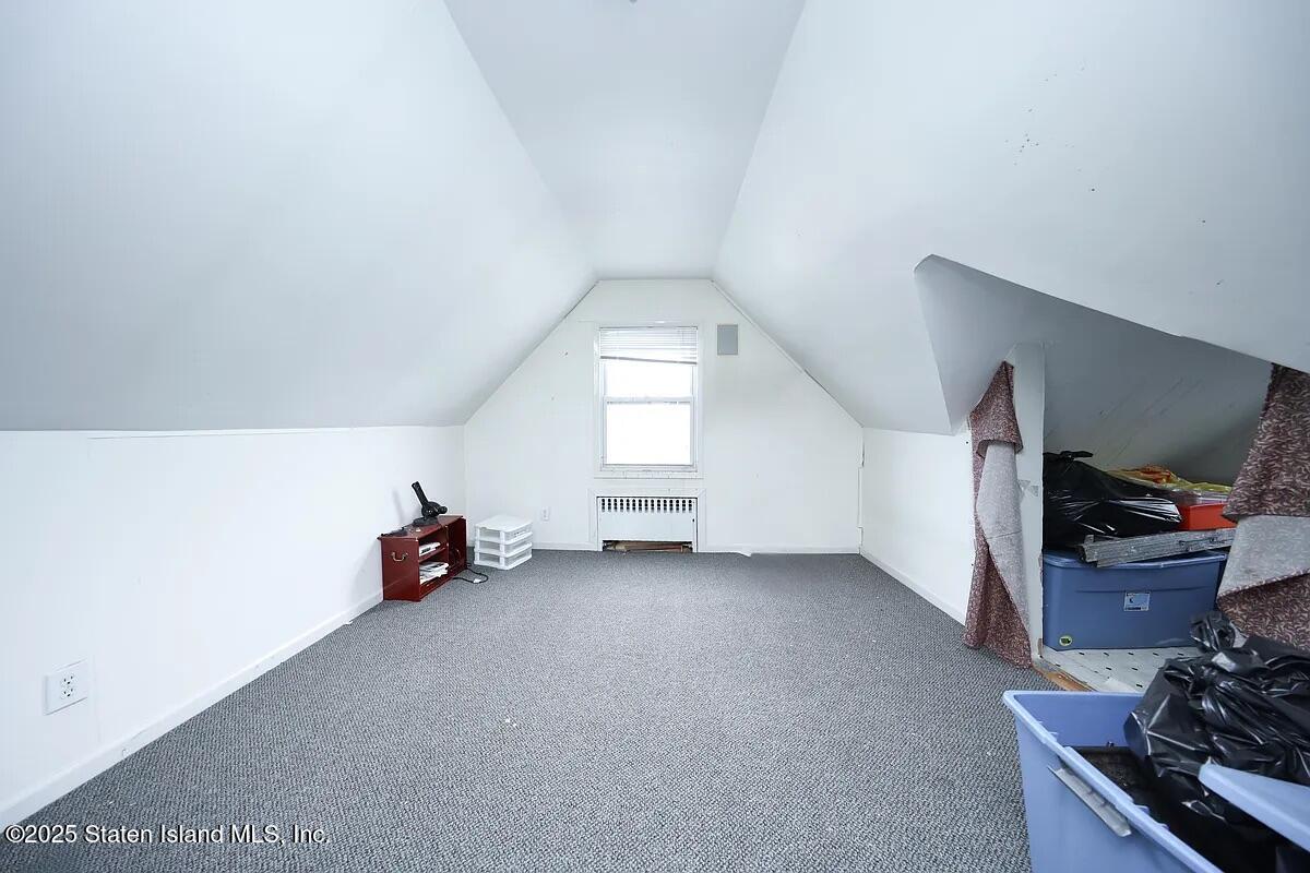1905 Clove Road Staten Island, NY 10304 - Photo 14 of 29 a view of a livingroom with furniture and a window