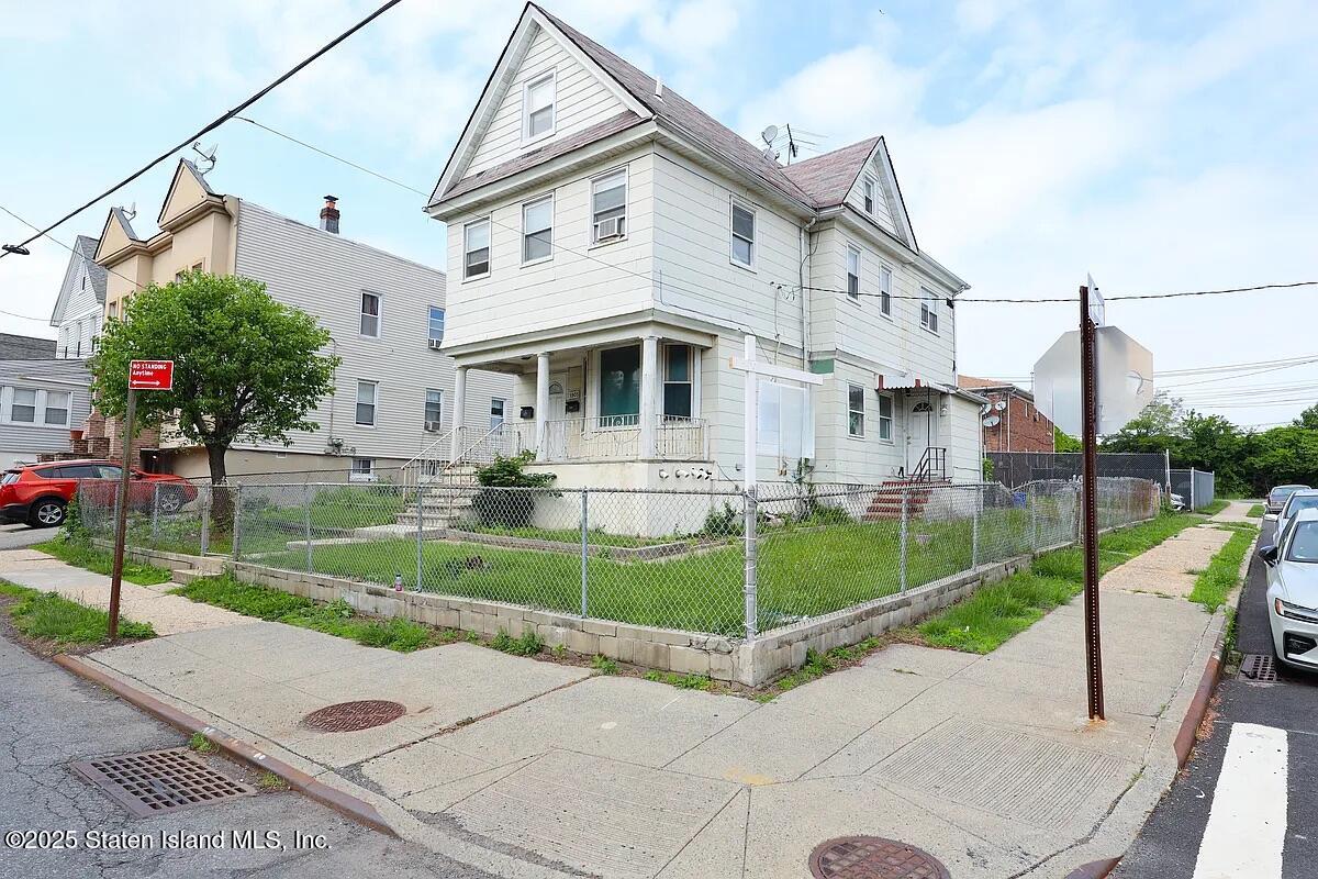 1905 Clove Road Staten Island, NY 10304 - Photo 2 of 29 a front view of a house with a yard