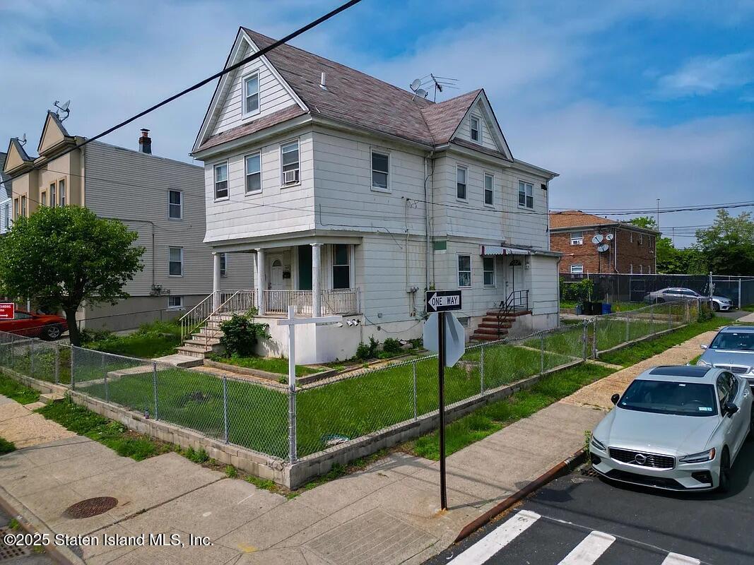 1905 Clove Road Staten Island, NY 10304 - Photo 6 of 29 a view of a house with backyard and porch