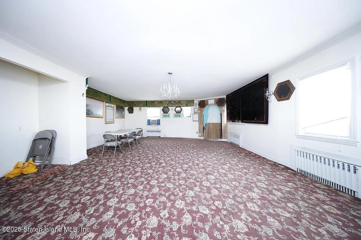 1905 Clove Road Staten Island, NY 10304 - Photo 7 of 29 a room with a stove and a window