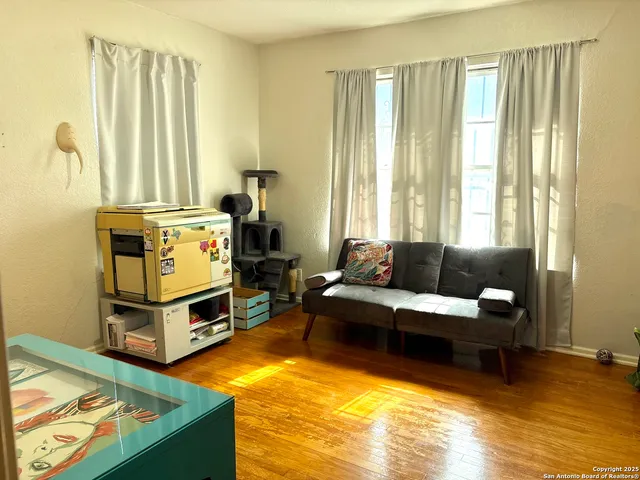 a view of kitchen with furniture and flat screen tv