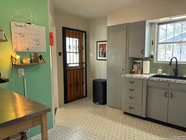 a view of a backyard of the house