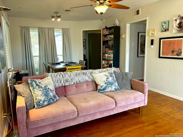 a view of a workspace with furniture and a fireplace