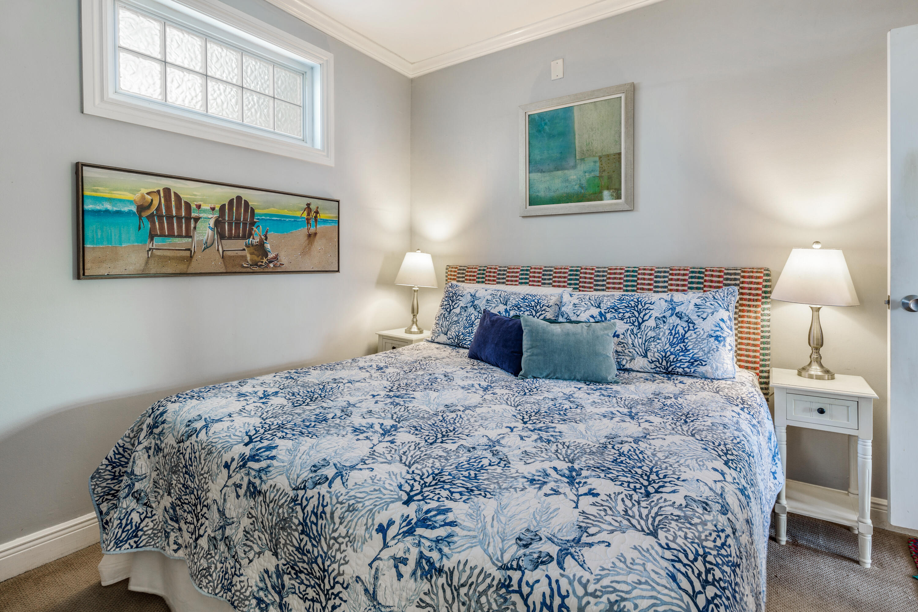 508 Louisa Street, Unit 3 Key West, FL 33040 - Photo 16 of 23 a bedroom with a bed and painting on the wall