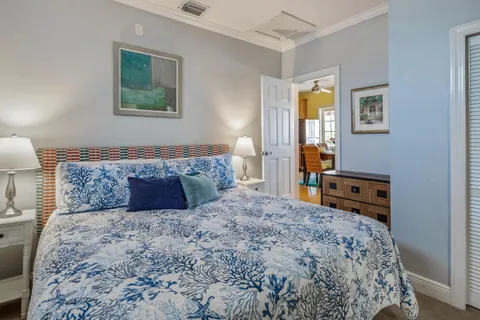 a bedroom with a large bed and a window