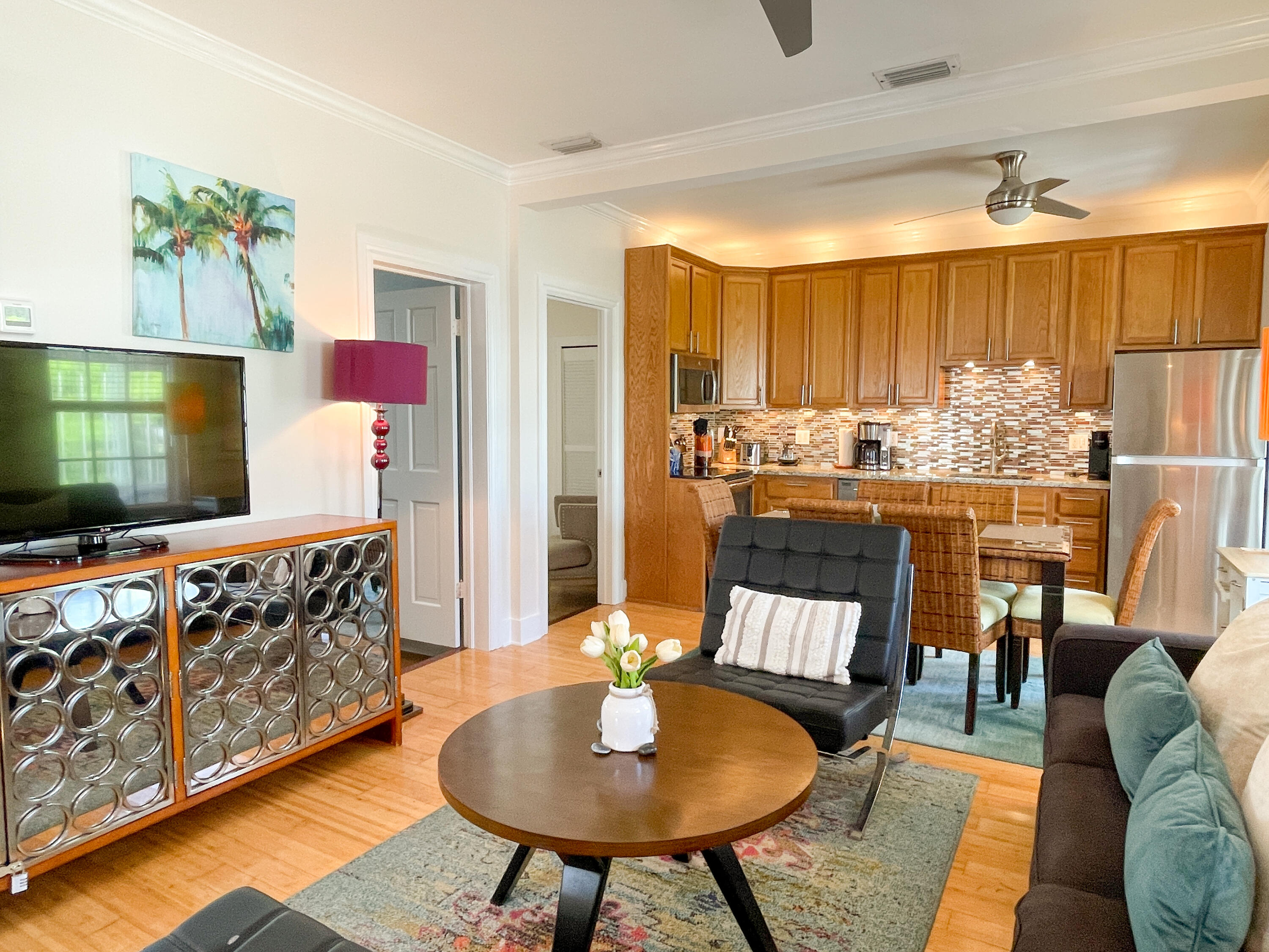 508 Louisa Street, Unit 3 Key West, FL 33040 - Photo 3 of 23 a living room with furniture and a flat screen tv