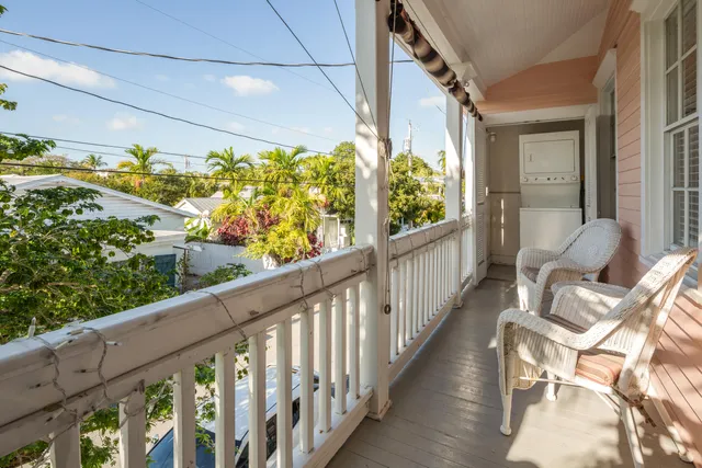 a view of balcony with furniture