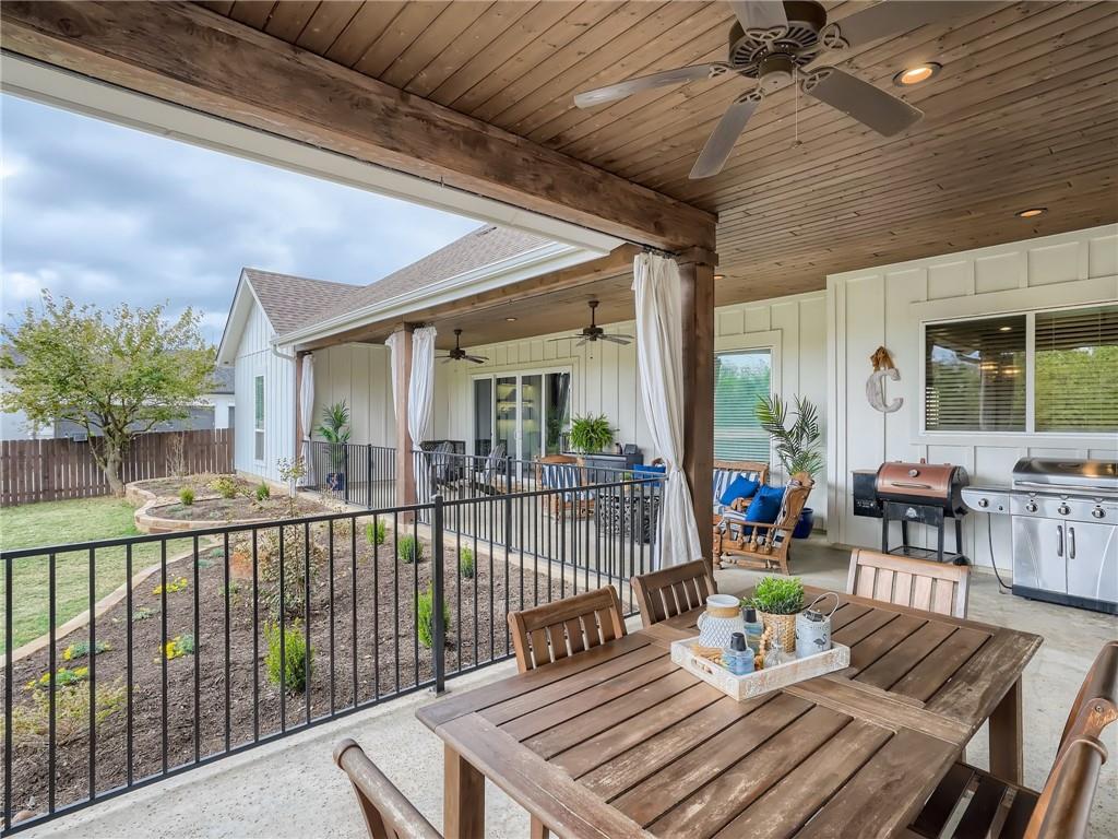 132 Huerta Road Florence, TX 76527 - Photo 29 of 40 An inviting covered patio offers ample space for entertaining and relaxation, overlooking a landscaped yard.