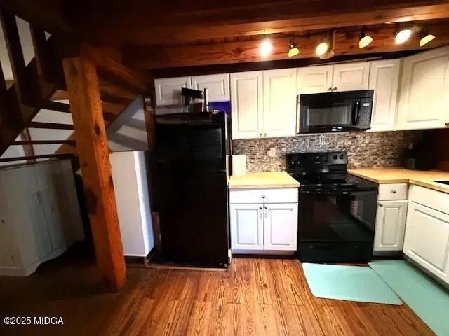 a kitchen with a sink and a stove