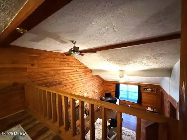 a view of balcony with wooden floor and fence