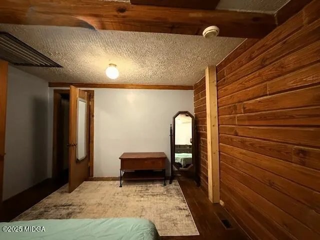 a view of bedroom with a bed and furniture
