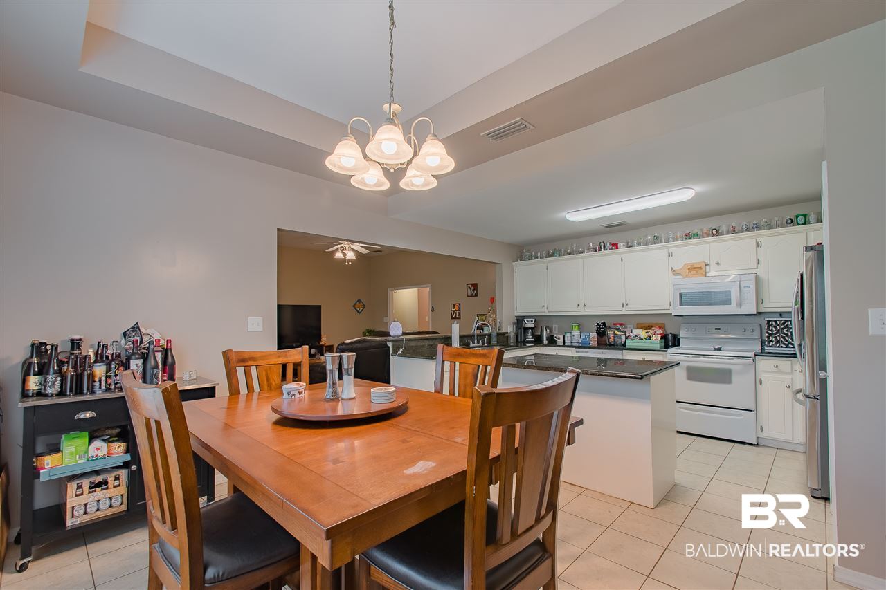 9211 Huckleberry Drive Daphne, AL 36527 - Photo 13 of 35 Dining to Kitchen