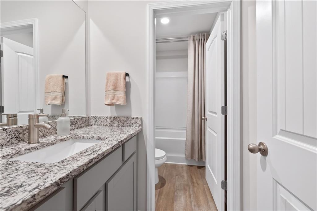 480 Overlook Road Covington, GA 30014 - Photo 12 of 20 a bathroom with a granite countertop sink and a mirror