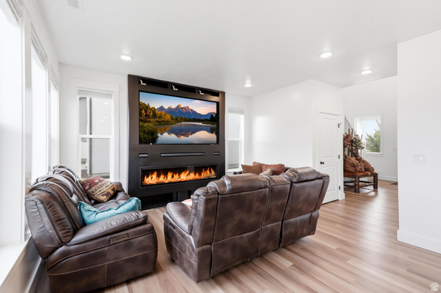 347 Ropelato Drive Logan, UT 84321 - Photo 7 of 46 Living area featuring a built-in media center with an integrated linear fireplace