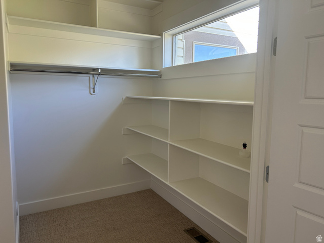 2688 Read Lane Preston, ID 83263 - Photo 16 of 18 Walk-in closet featuring built-in shelving, a garment rod, and a high horizontal window