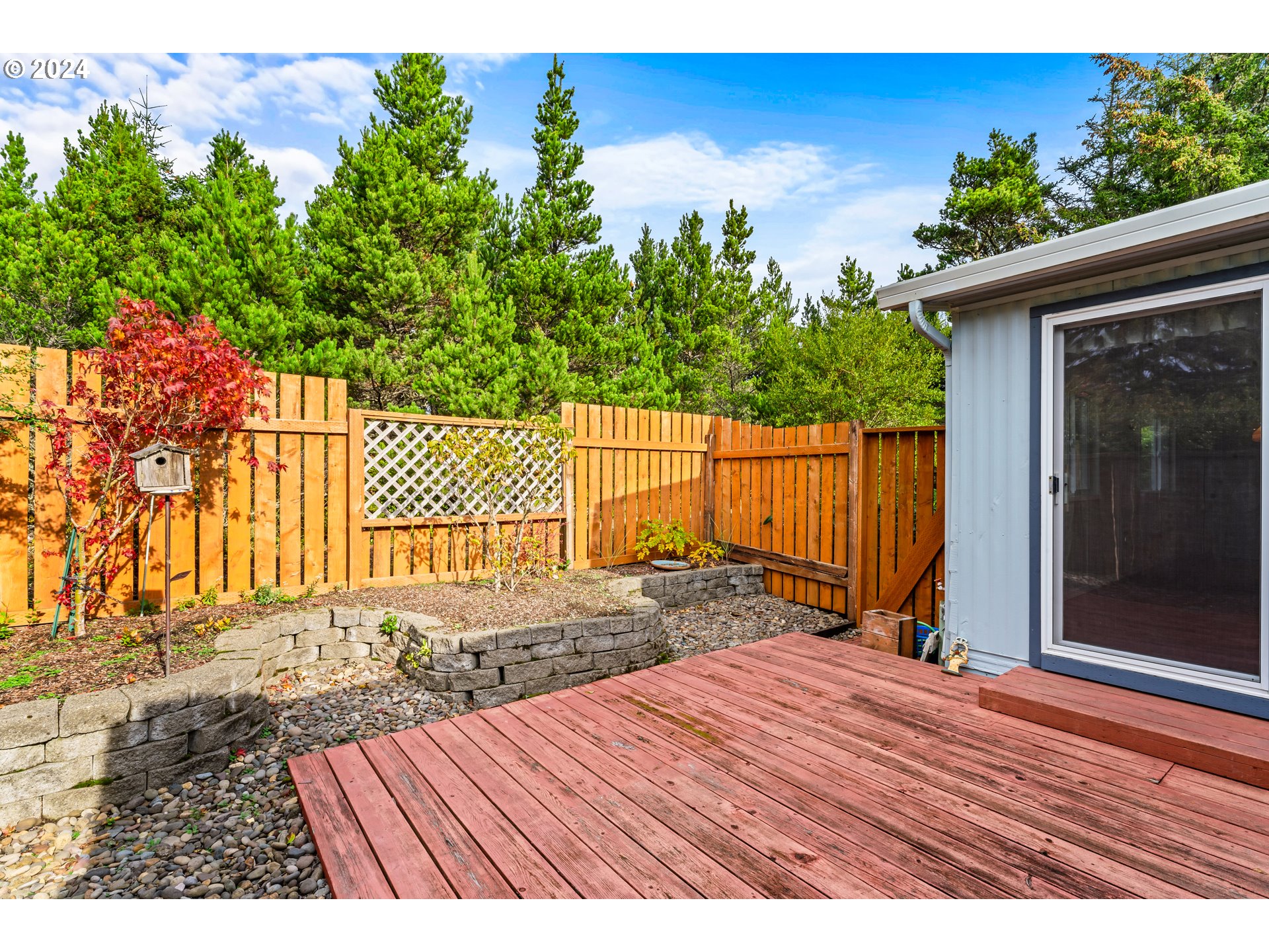 1600 Rhododendron Drive, Unit 406 Florence, OR 97439 - Photo 16 of 42 a view of backyard with small cabin