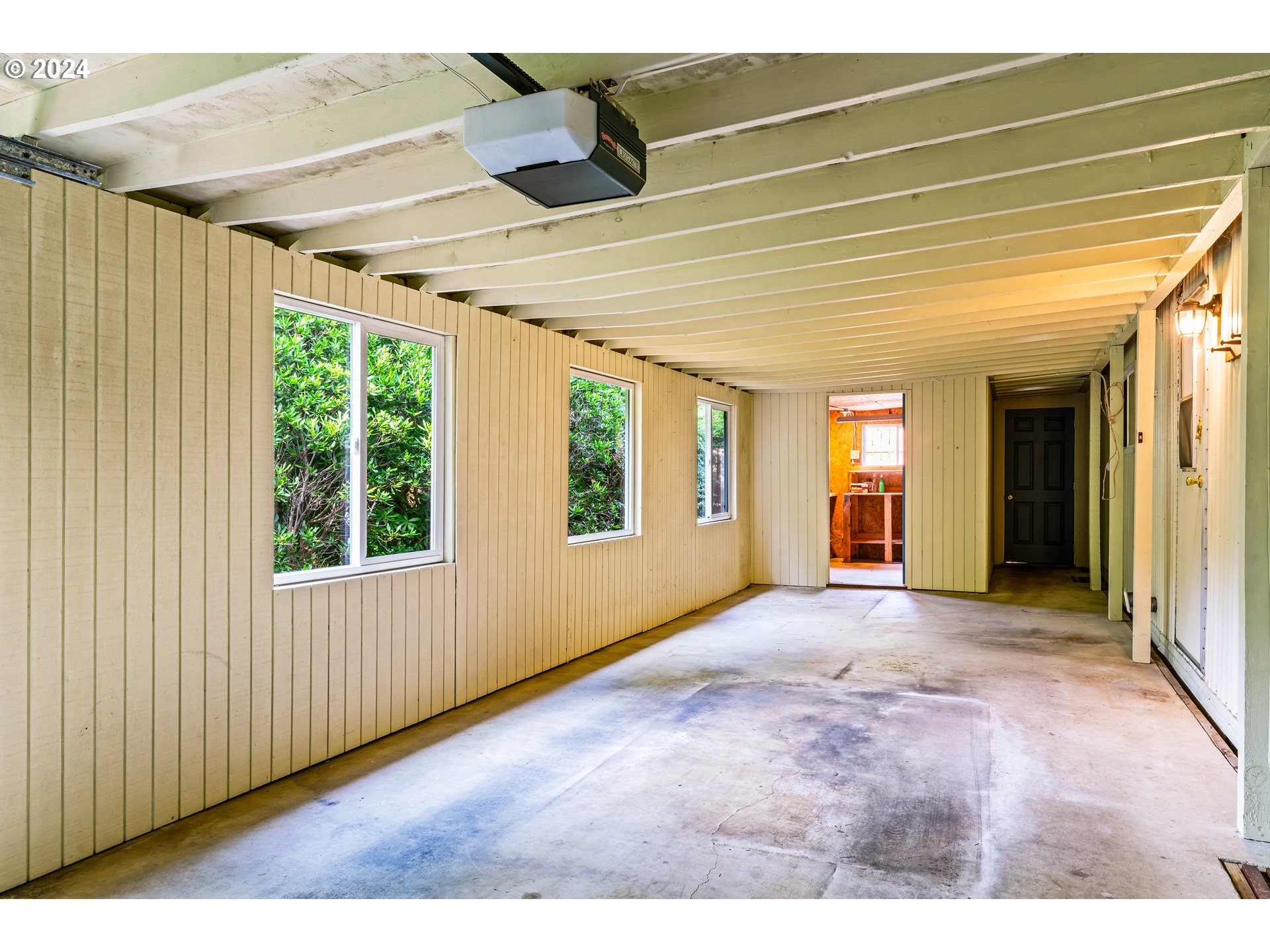 1600 Rhododendron Drive, Unit 406 Florence, OR 97439 - Photo 29 of 42 a view of an empty room with window and kitchen view