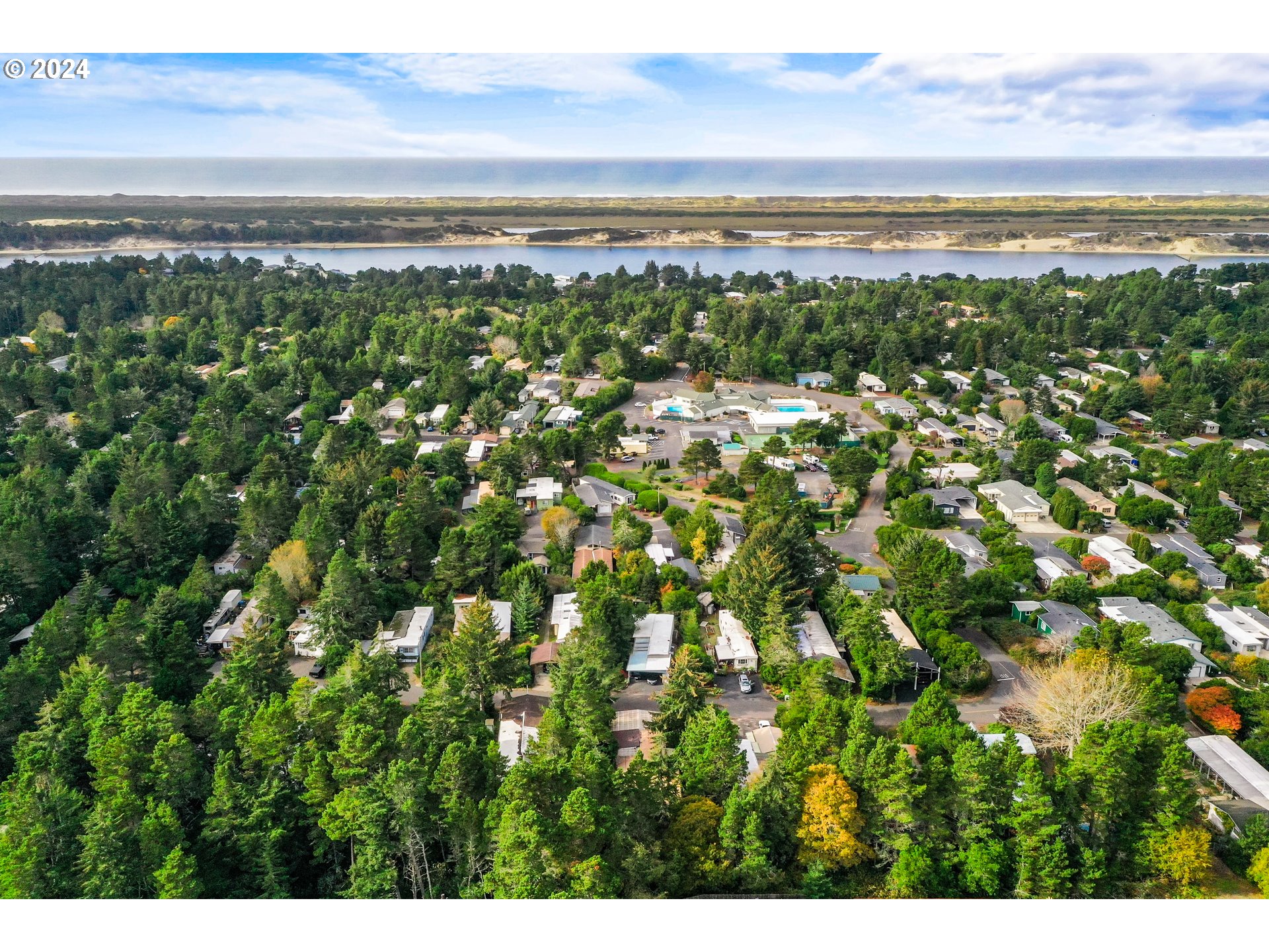 1600 Rhododendron Drive, Unit 406 Florence, OR 97439 - Photo 41 of 42 a view of an ocean and beach