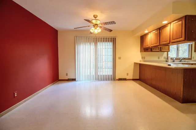 a view of a kitchen with a sink and cabinet area