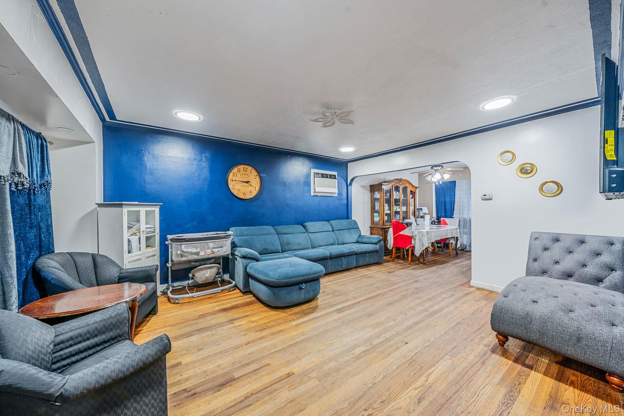 98 Miriam Street Valley Stream, NY 11581 - Photo 3 of 16 a living room with furniture and wooden floor