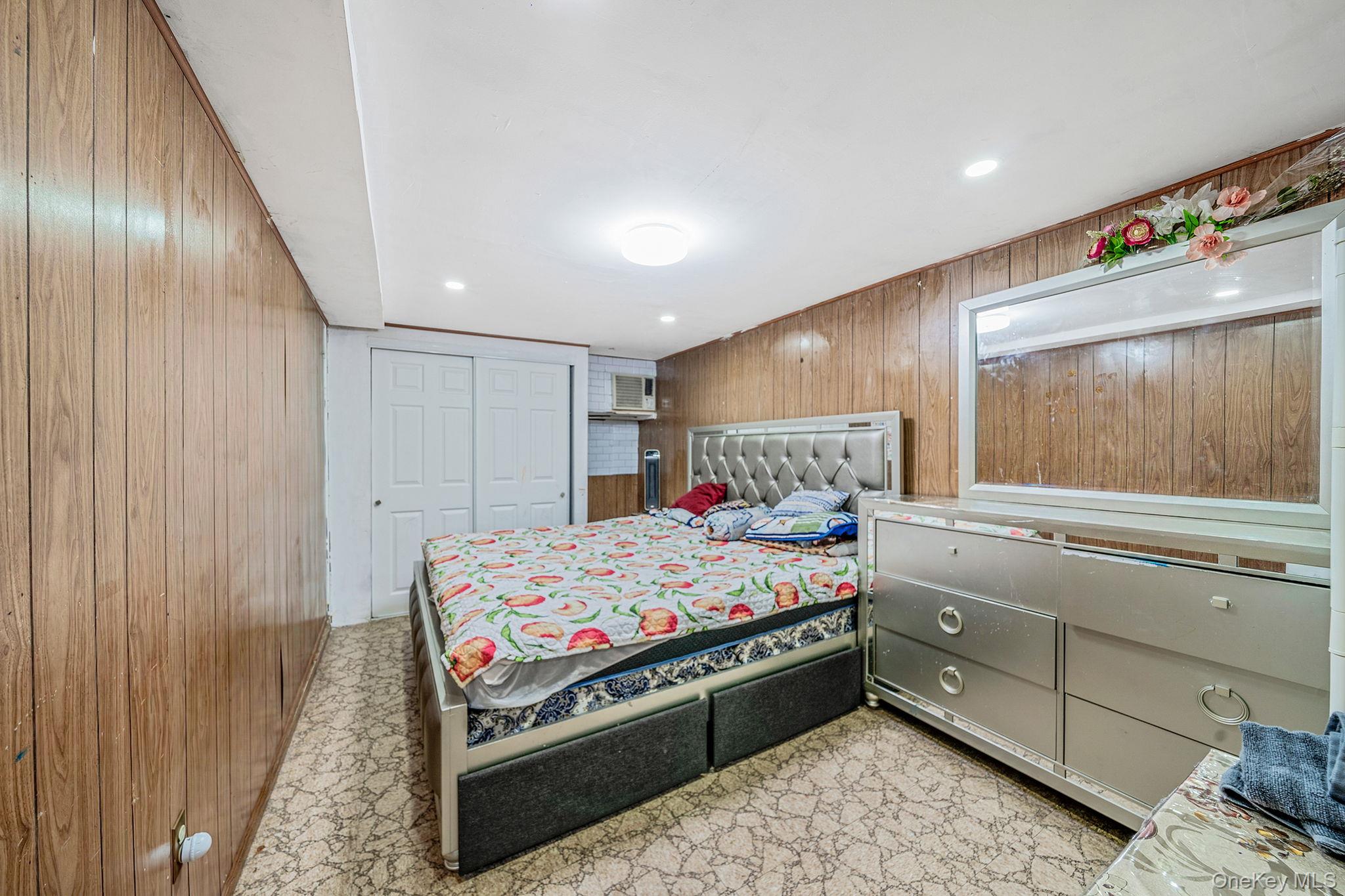 98 Miriam Street Valley Stream, NY 11581 - Photo 8 of 16 a bed room with a bed and a dresser