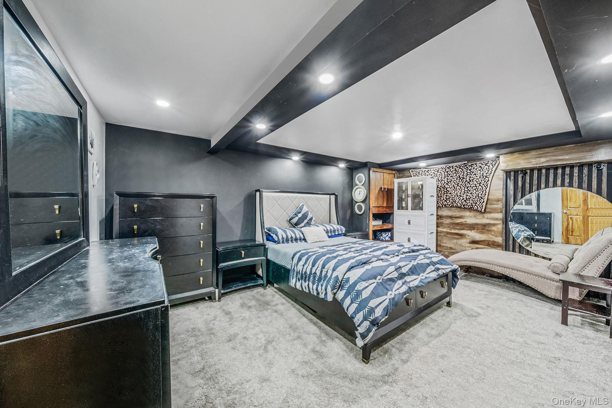 98 Miriam Street Valley Stream, NY 11581 - Photo 9 of 16 a bedroom with a bed and large mirror in closet