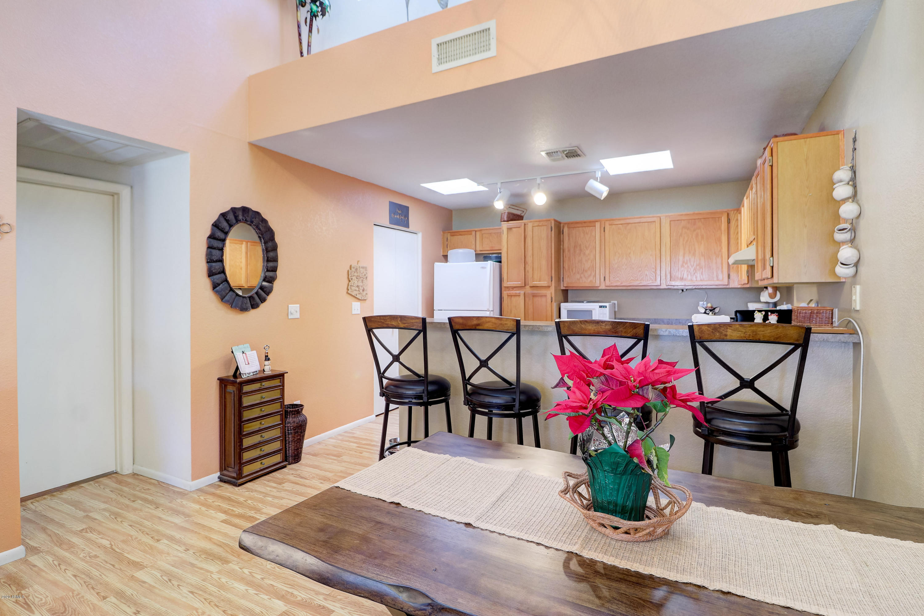 14300 West Bell Road, Unit 204 Surprise, AZ 85374 - Photo 9 of 39 Great Room Dining Plus Raised Snackbar