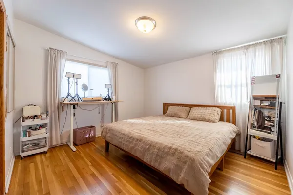 a bedroom with a bed and a cabinets