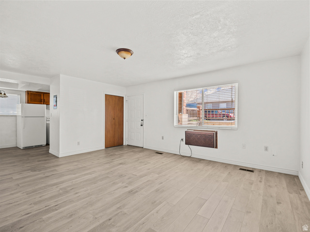 460 200 South Provo, UT 84606 - Photo 16 of 66 Unfurnished living room featuring light wood-type flooring and plenty of natural light
