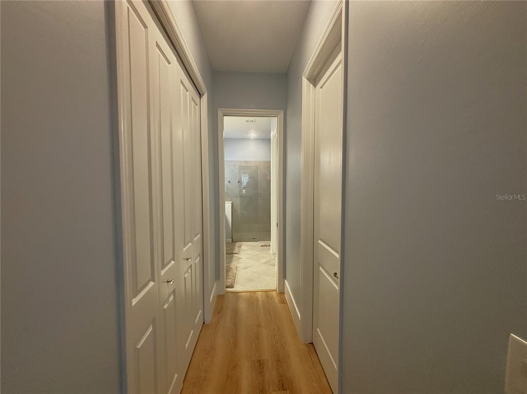 17435 Jadestone Court Venice, FL 34293 - Photo 13 of 68 a view of a bathroom from a hallway