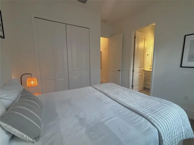 a bathroom with a sink toilet and a mirror