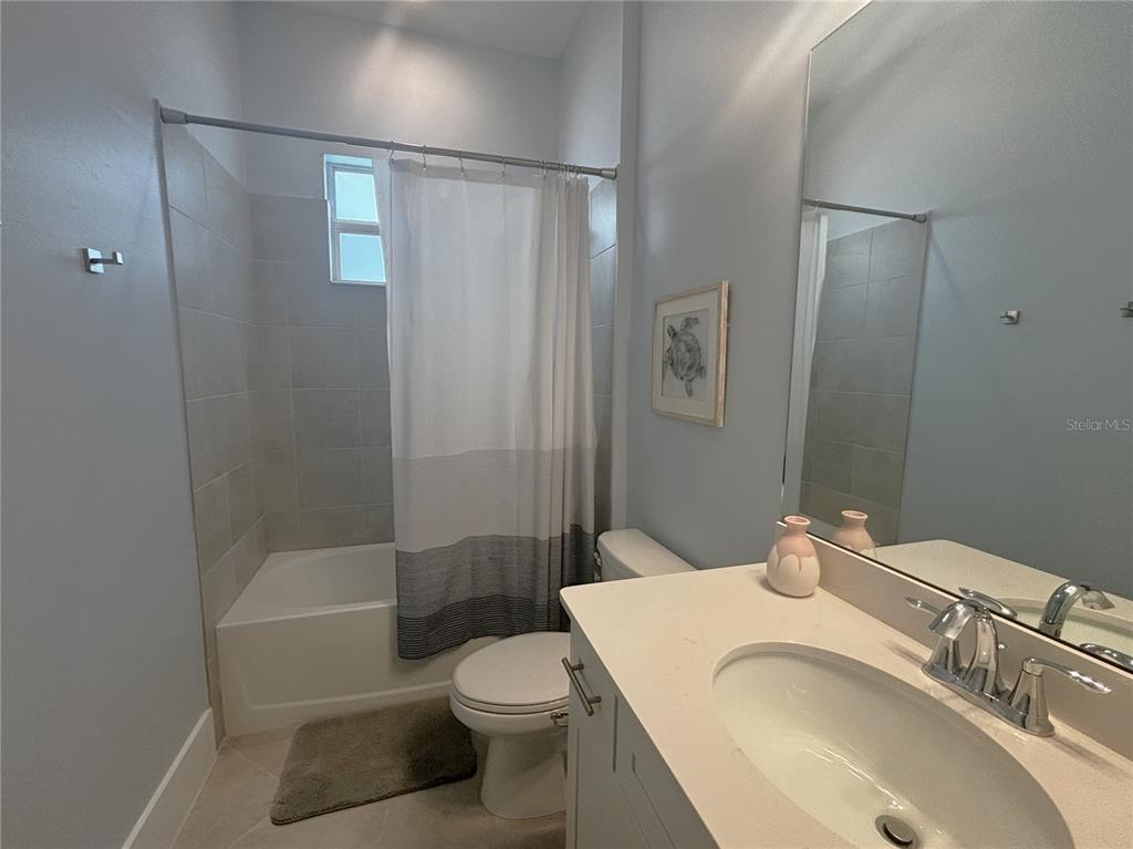 17435 Jadestone Court Venice, FL 34293 - Photo 21 of 68 a bathroom with a sink a toilet and shower