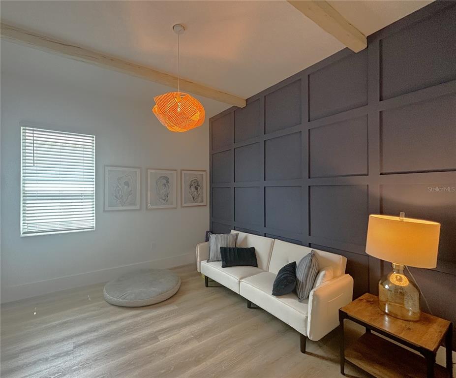 17435 Jadestone Court Venice, FL 34293 - Photo 22 of 68 a living room with furniture and a window