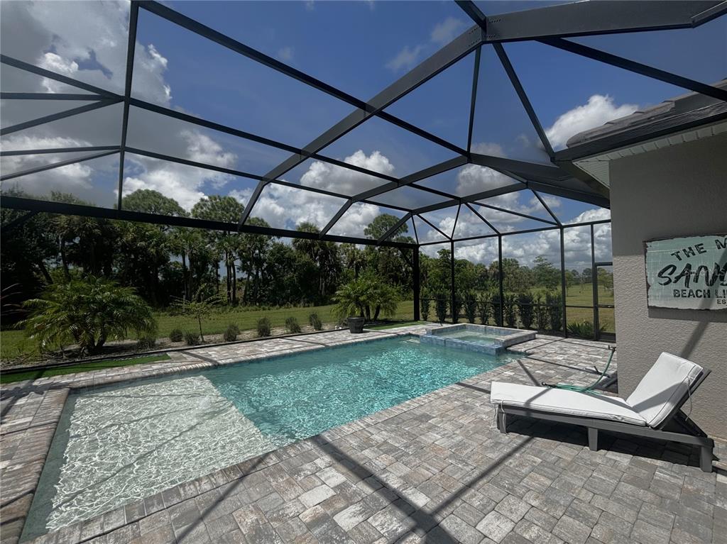 17435 Jadestone Court Venice, FL 34293 - Photo 25 of 68 a view of a backyard with sitting area