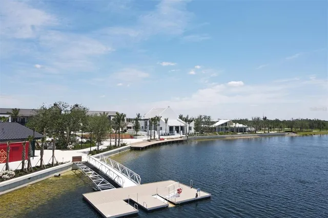 a view of a lake with houses in the back