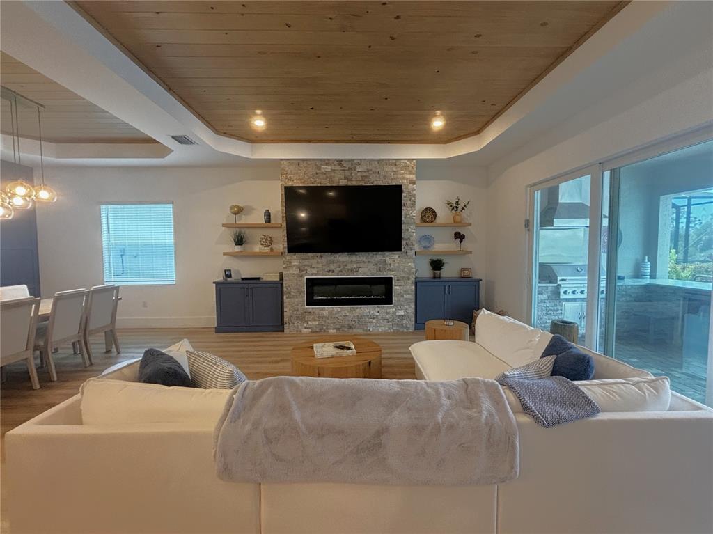 17435 Jadestone Court Venice, FL 34293 - Photo 7 of 68 a living room with furniture and a flat screen tv