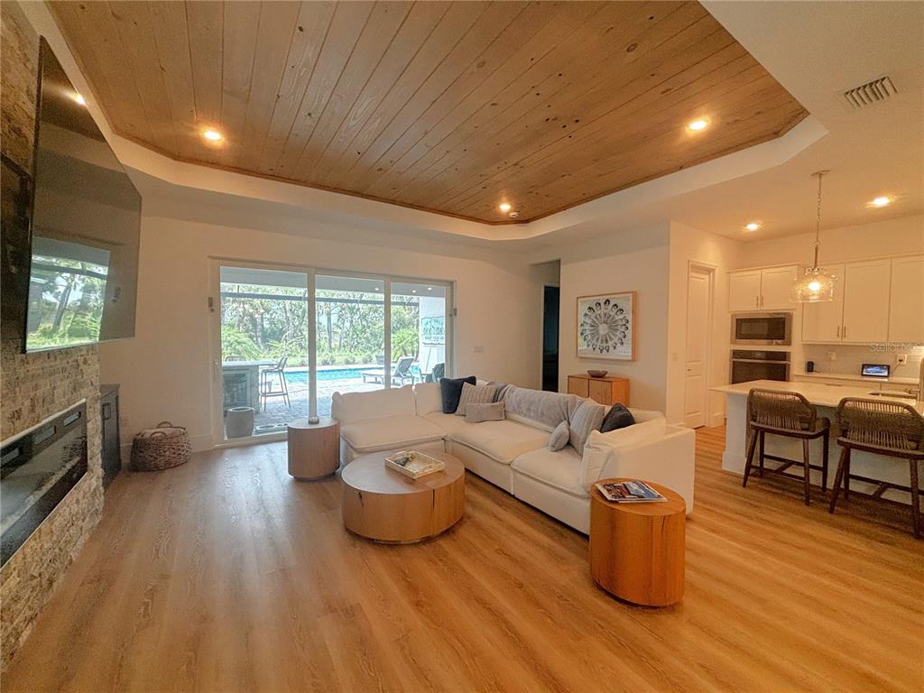 17435 Jadestone Court Venice, FL 34293 - Photo 9 of 68 a living room with furniture and wooden floor