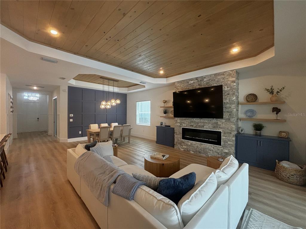 17435 Jadestone Court Venice, FL 34293 - Photo 10 of 68 a living room with furniture and a flat screen tv