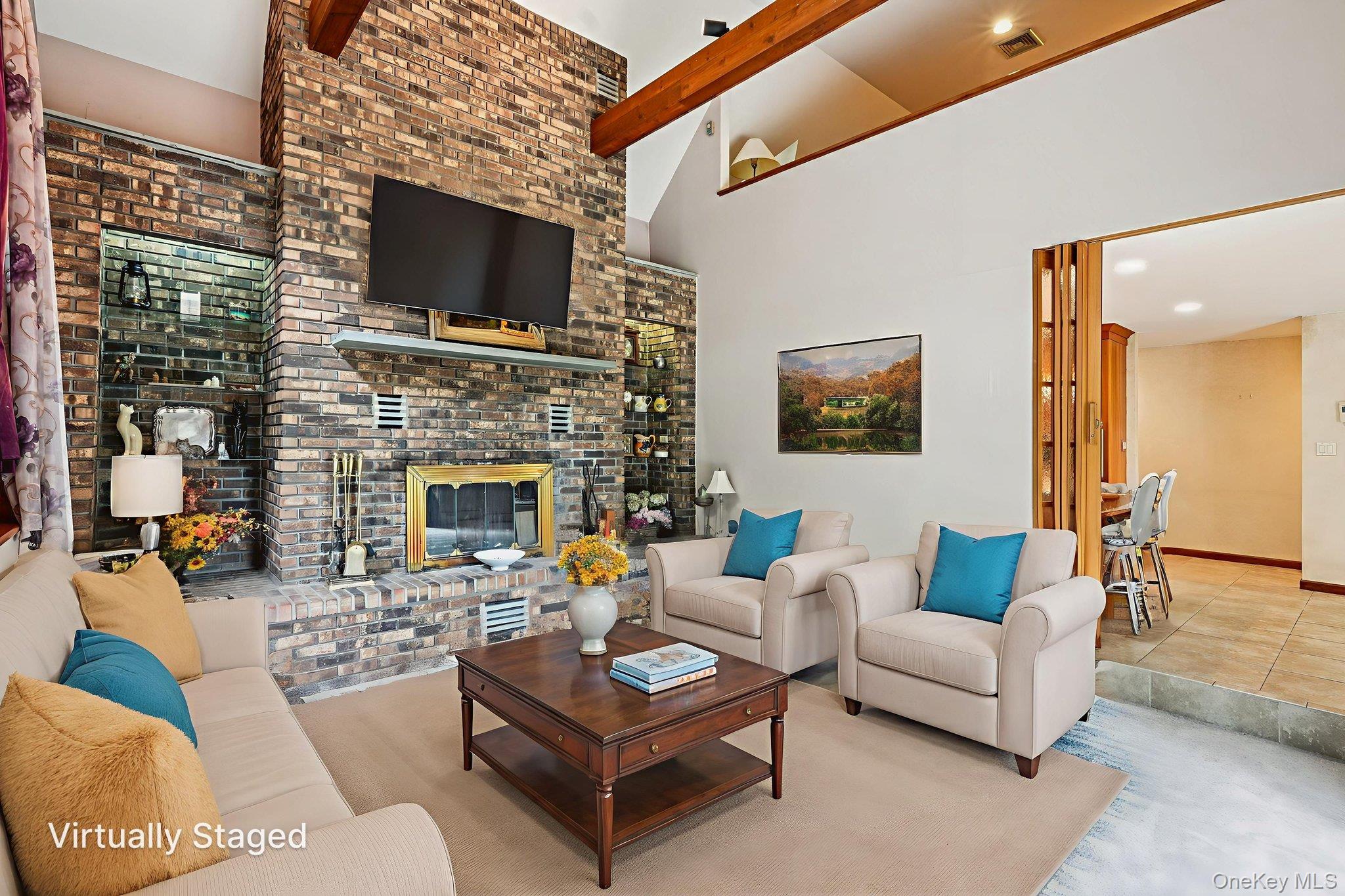 1 Lookout Road Tuxedo Park, NY 10987 - Photo 12 of 40 a living room with furniture a fireplace and a flat screen tv