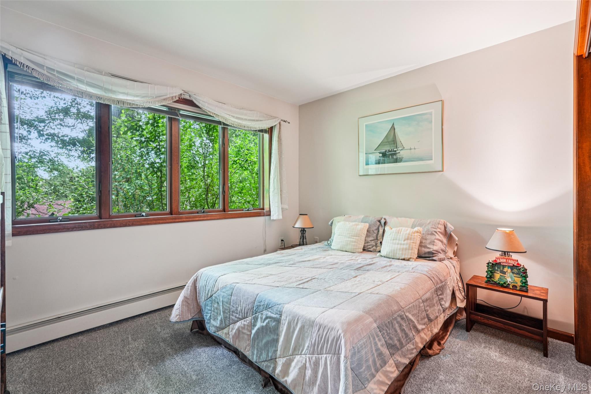 1 Lookout Road Tuxedo Park, NY 10987 - Photo 17 of 40 a bedroom with a bed and a painting on the wall