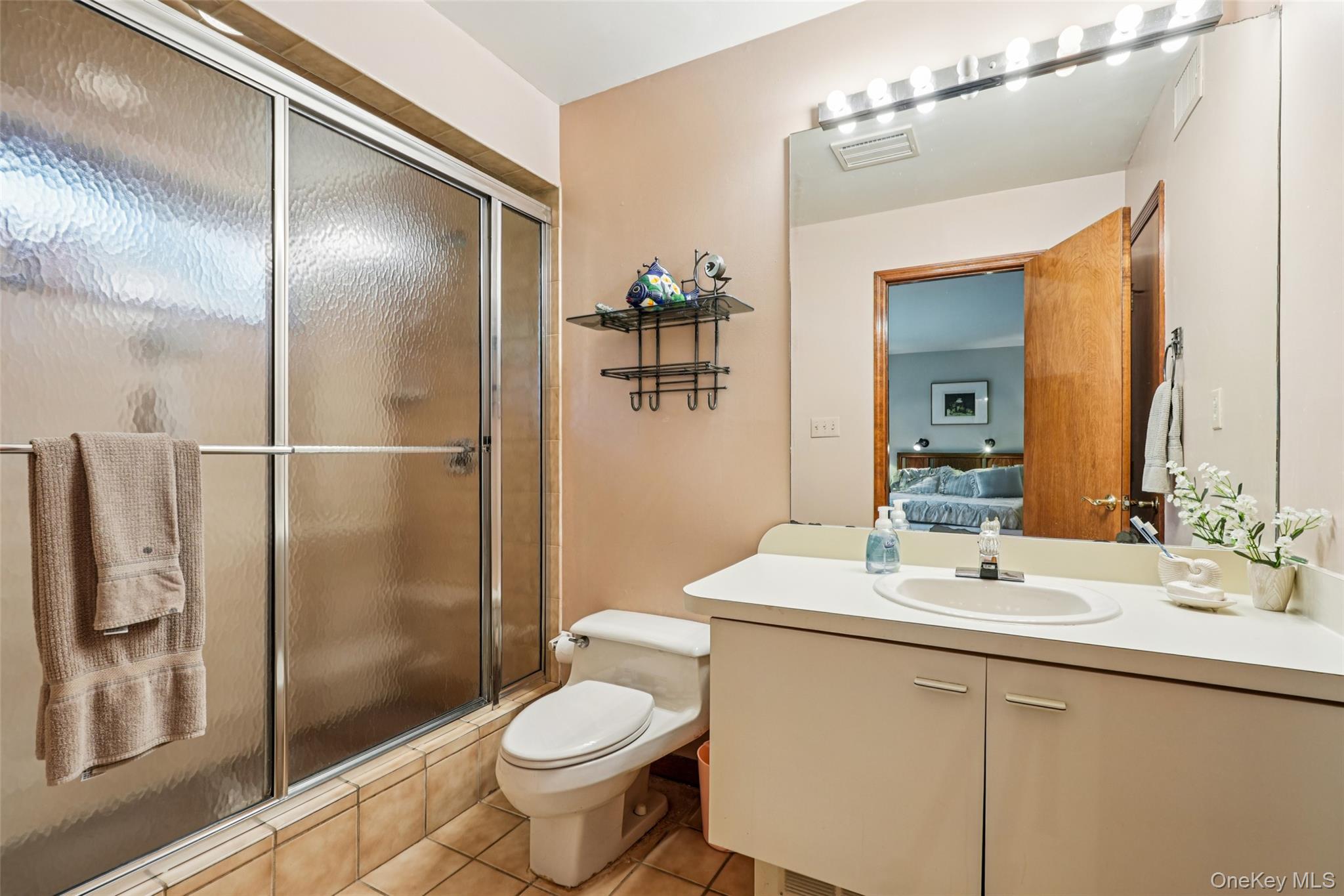 1 Lookout Road Tuxedo Park, NY 10987 - Photo 21 of 40 a bathroom with a sink toilet and shower