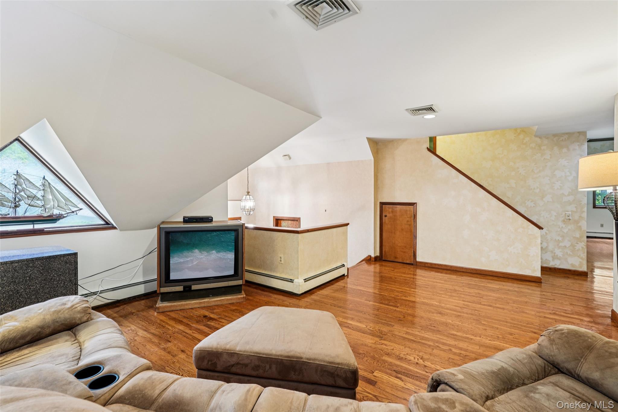 1 Lookout Road Tuxedo Park, NY 10987 - Photo 25 of 40 a living room with furniture and stairs