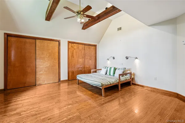 a living room with a bed furniture and a window