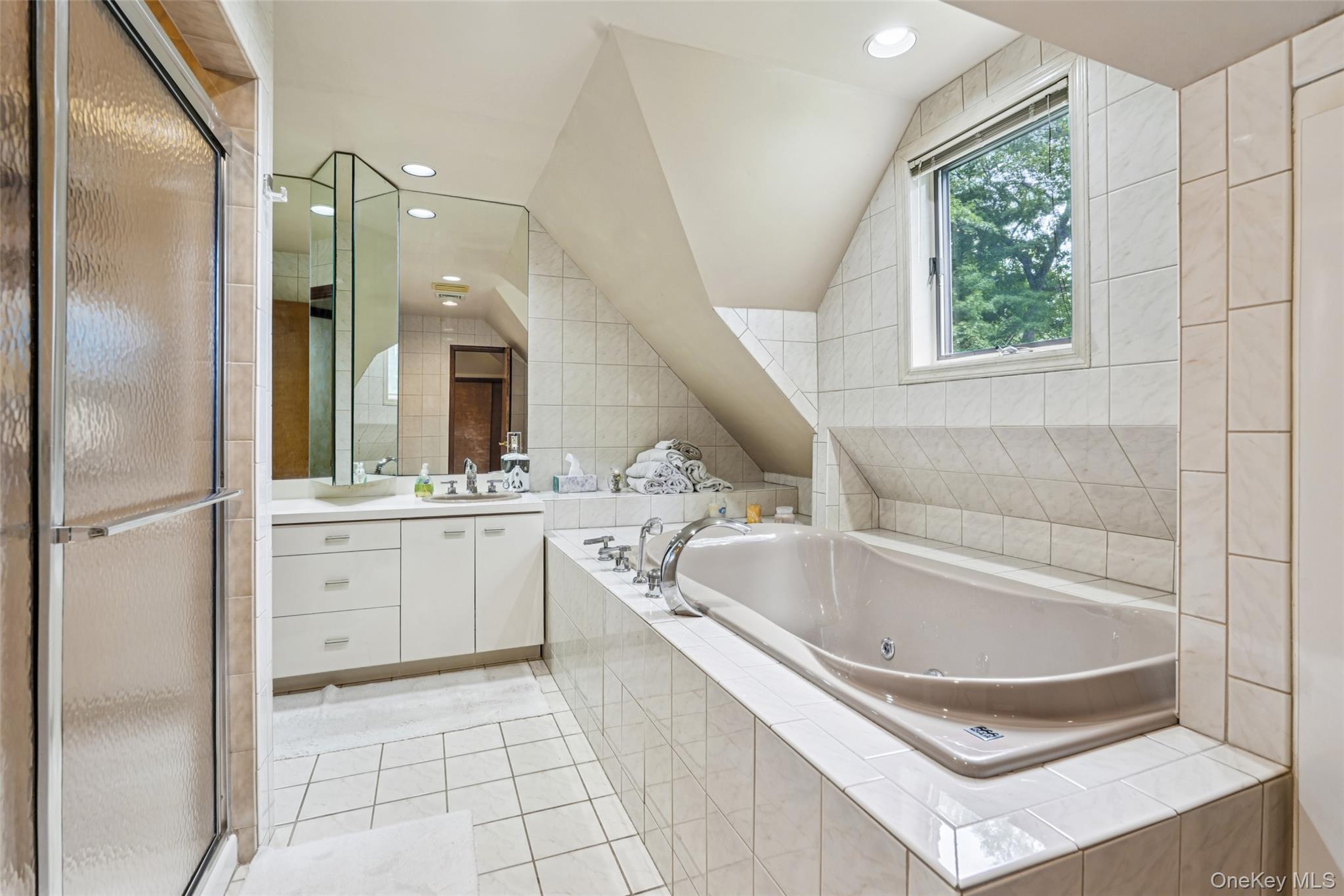 1 Lookout Road Tuxedo Park, NY 10987 - Photo 28 of 40 a bathroom with a tub sink and mirror