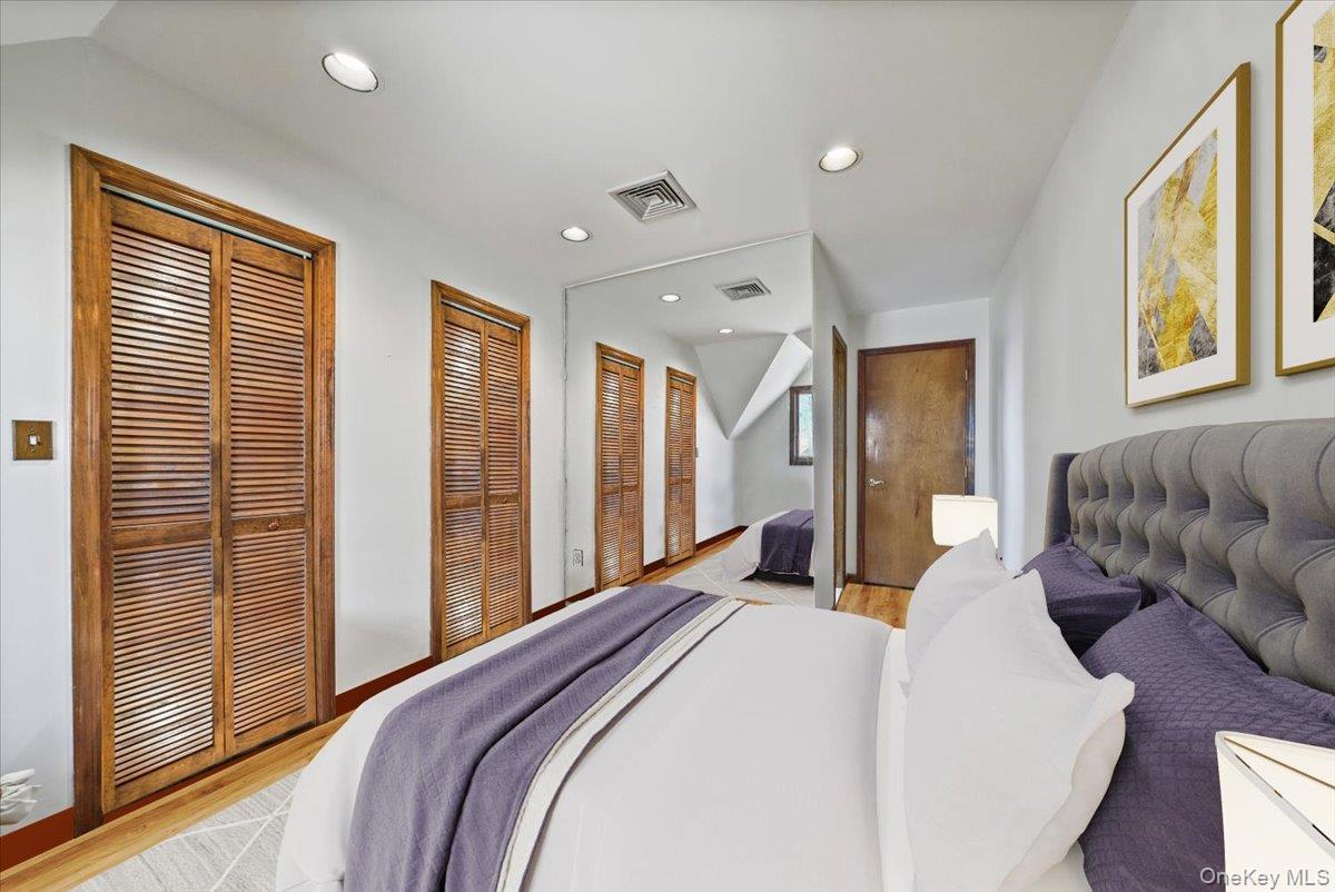 1 Lookout Road Tuxedo Park, NY 10987 - Photo 30 of 40 a spacious bedroom with a bed and glass door