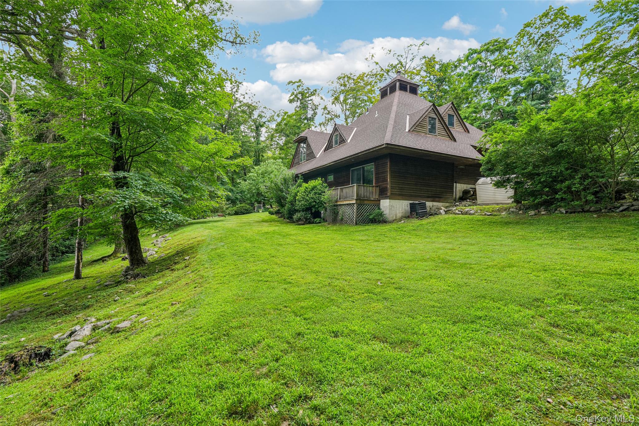 1 Lookout Road Tuxedo Park, NY 10987 - Photo 37 of 40 a view of a garden with a house in the background