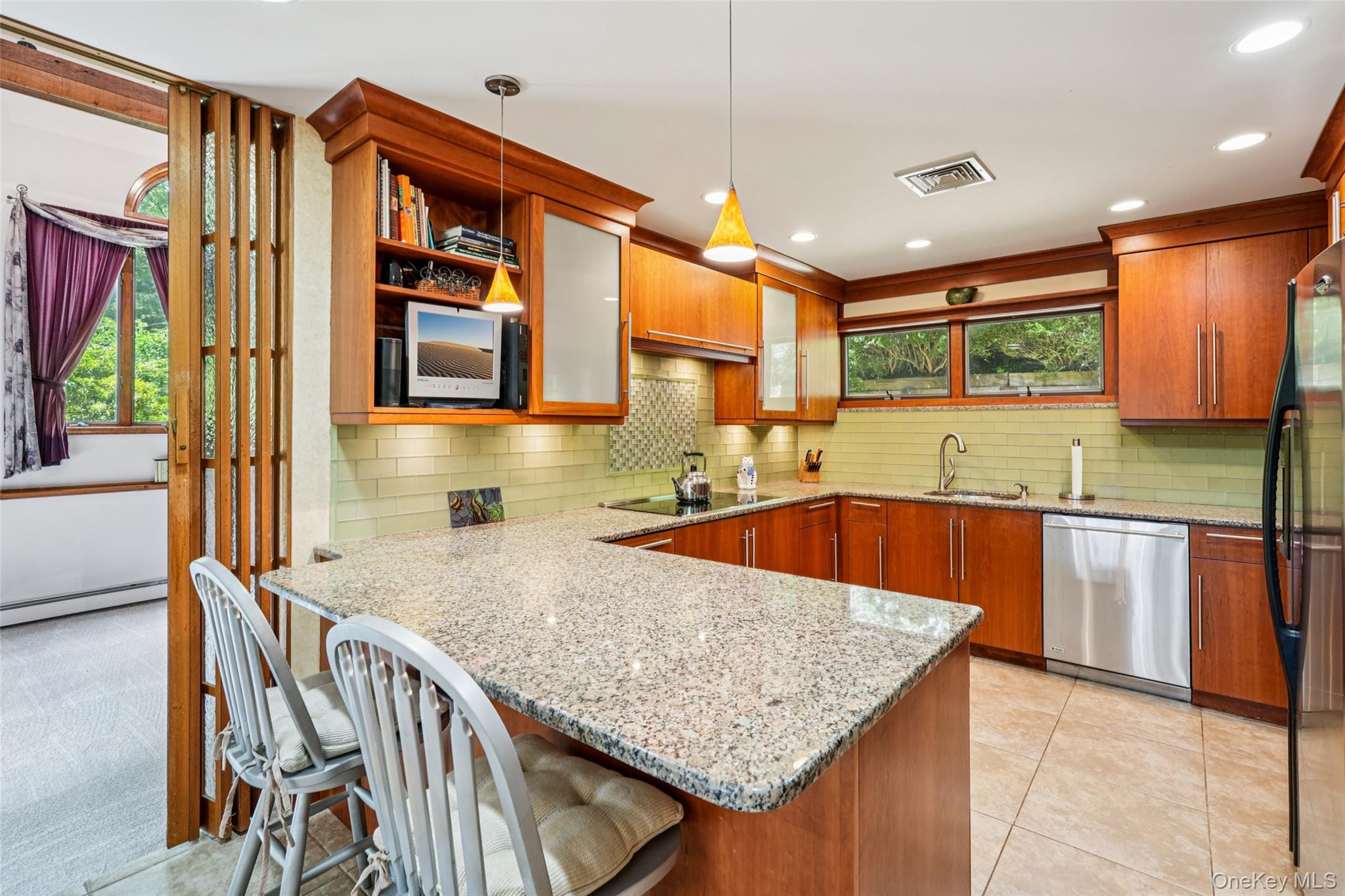 1 Lookout Road Tuxedo Park, NY 10987 - Photo 10 of 40 a kitchen with stainless steel appliances granite countertop a stove a sink and a microwave