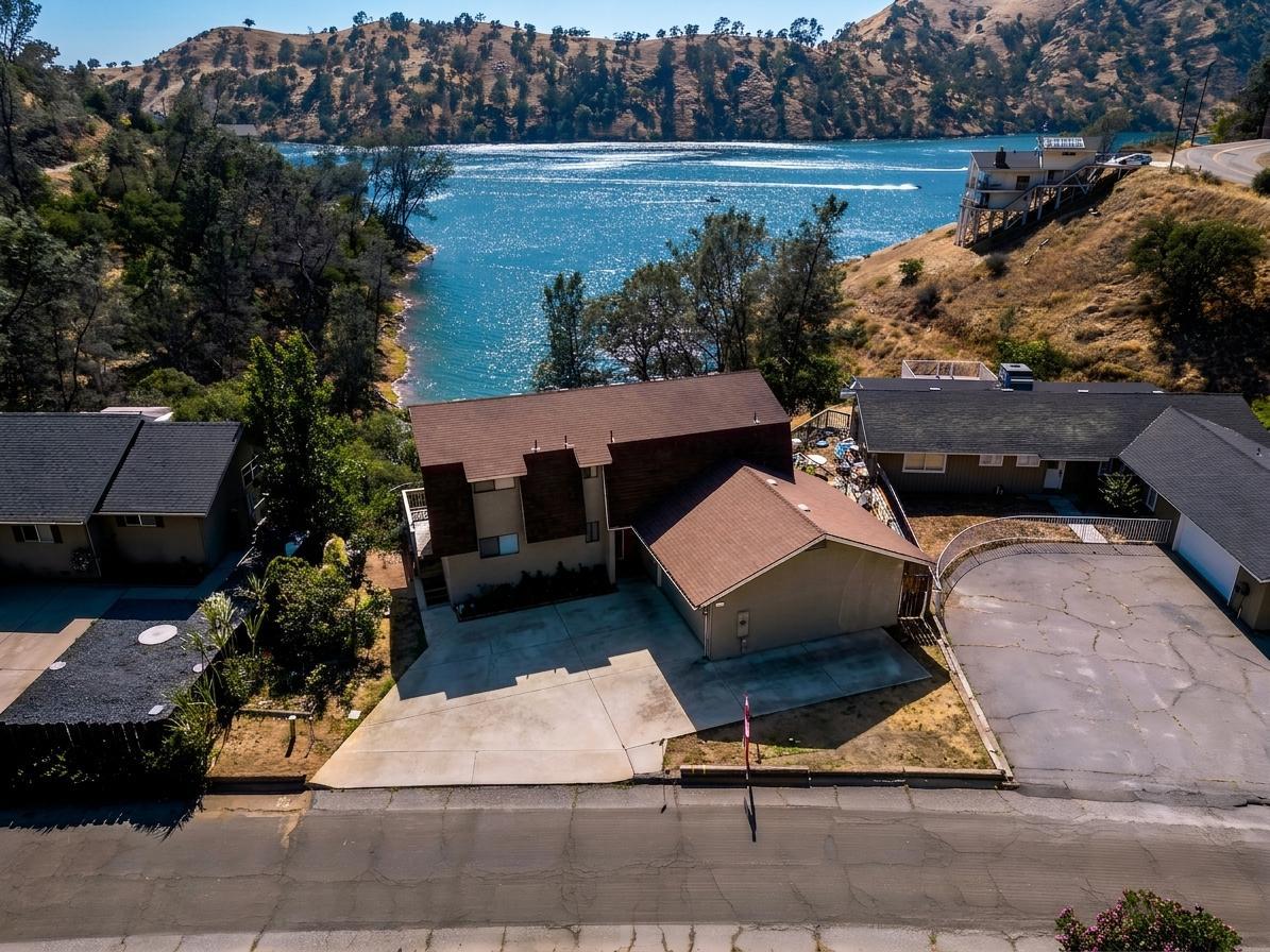 27817 Sky Harbour Road Friant, CA 93626 - Photo 33 of 36 a view of a yard and front view of a house
