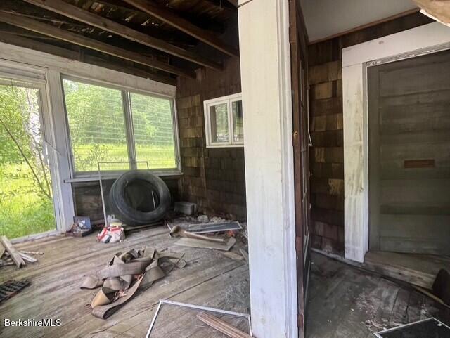 477 Mohawk Trail Florida, MA 01343 - Photo 9 of 9 a room with furniture and a gate